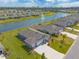 Community aerial view showcasing a beautiful pond and well-manicured lawns at 2840 Monaghan Dr, Ormond Beach, FL 32174