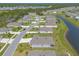 Aerial view of the community, featuring a scenic pond and surrounding greenery at 2840 Monaghan Dr, Ormond Beach, FL 32174