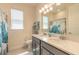 Bathroom featuring double sink vanity, toilet, large mirror, and lots of lighting at 2840 Monaghan Dr, Ormond Beach, FL 32174