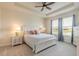 Bedroom featuring a tray ceiling, ceiling fan, and soft, inviting colors and bright natural light at 2840 Monaghan Dr, Ormond Beach, FL 32174