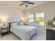 Bedroom with cozy bed, side tables, and ample natural light from two windows with blinds at 2840 Monaghan Dr, Ormond Beach, FL 32174