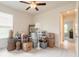 Bedroom being used for storage with boxes and shelves, carpet flooring, and ceiling fan at 2840 Monaghan Dr, Ormond Beach, FL 32174