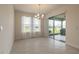 Dining room with tile flooring, large windows and sliding glass doors for natural light at 2840 Monaghan Dr, Ormond Beach, FL 32174