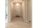 Bright entryway with tile floors, coffered ceiling, and a view into the main living areas at 2840 Monaghan Dr, Ormond Beach, FL 32174
