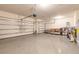 Spacious three-car garage with ample storage and epoxy flooring at 2840 Monaghan Dr, Ormond Beach, FL 32174