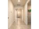 Hallway with tile flooring and arched doorways leading to other rooms in the home at 2840 Monaghan Dr, Ormond Beach, FL 32174