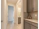 Hallway with tile floors leading to the bathroom and other rooms at 2840 Monaghan Dr, Ormond Beach, FL 32174