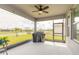 Screened patio with ceiling fan overlooking the lake, perfect for outdoor dining at 2840 Monaghan Dr, Ormond Beach, FL 32174