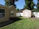 Backyard featuring well maintained lawn, exterior building, and privacy fence at 543 Sandy Oaks Blvd, Ormond Beach, FL 32174