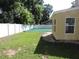 View of the large backyard featuring well-maintained grass and privacy fence at 543 Sandy Oaks Blvd, Ormond Beach, FL 32174
