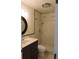 Updated bathroom featuring tiled shower with mosaic accents and a vanity with ample storage at 543 Sandy Oaks Blvd, Ormond Beach, FL 32174