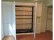Murphy bed within custom built-in closet and storage space in a spare bedroom at 543 Sandy Oaks Blvd, Ormond Beach, FL 32174