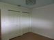 Bedroom featuring double closets and decorative ceiling light at 543 Sandy Oaks Blvd, Ormond Beach, FL 32174