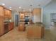 Open kitchen with granite countertops, stainless steel appliances, and an island at 543 Sandy Oaks Blvd, Ormond Beach, FL 32174