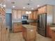 Well-equipped kitchen with stainless steel appliances, granite countertops, and a center island at 543 Sandy Oaks Blvd, Ormond Beach, FL 32174
