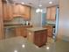 Well-designed kitchen with granite countertops, stainless steel appliances, and a kitchen island at 543 Sandy Oaks Blvd, Ormond Beach, FL 32174
