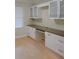 Office space with custom cabinets, drawers, granite countertops, and hardwood floors at 543 Sandy Oaks Blvd, Ormond Beach, FL 32174