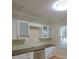 Office space with custom cabinets, drawers, granite countertops, and hardwood floors at 543 Sandy Oaks Blvd, Ormond Beach, FL 32174