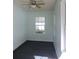 Bright room with carpet and large windows offering backyard views at 543 Sandy Oaks Blvd, Ormond Beach, FL 32174