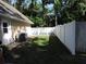 Side yard with privacy fence featuring lush green lawn at 543 Sandy Oaks Blvd, Ormond Beach, FL 32174
