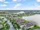 Aerial view of a residential area with waterfront properties and enclosed pools at 568 Luna Bella Ln, New Smyrna Beach, FL 32168