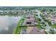 Aerial view of waterfront community with well-kept lawns and screened-in pools at 568 Luna Bella Ln, New Smyrna Beach, FL 32168