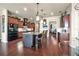 Open kitchen design featuring a spacious island with bar seating, pendant lighting, and custom cabinets at 568 Luna Bella Ln, New Smyrna Beach, FL 32168