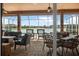 Relaxing covered patio with ample seating and lake views in the background at 568 Luna Bella Ln, New Smyrna Beach, FL 32168