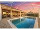 A private pool with a screened enclosure and brick paver deck at 568 Luna Bella Ln, New Smyrna Beach, FL 32168