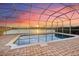 A private pool with screened enclosure overlooking a lake at 568 Luna Bella Ln, New Smyrna Beach, FL 32168