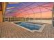Private pool with screened enclosure overlooking a lake and spectacular sunset at 568 Luna Bella Ln, New Smyrna Beach, FL 32168