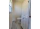 Bathroom featuring window, toilet and vanity with sink at 741 Ellen St, Daytona Beach, FL 32114