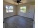 Bedroom featuring ceiling fan, LVP flooring, and windows at 741 Ellen St, Daytona Beach, FL 32114