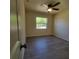 Bedroom with a ceiling fan, laminate flooring, one window, and neutral colored walls at 741 Ellen St, Daytona Beach, FL 32114