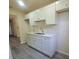 Bright kitchen showcases white cabinets, granite countertops, and stainless steel sink at 741 Ellen St, Daytona Beach, FL 32114