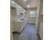 Bright kitchen with modern cabinets, countertops, stainless steel sink and window at 741 Ellen St, Daytona Beach, FL 32114