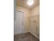 Functional laundry room equipped with utility sink hook-ups and shelving at 741 Ellen St, Daytona Beach, FL 32114