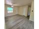 The Living Room features wood-style floors, a ceiling fan, and neutral paint at 741 Ellen St, Daytona Beach, FL 32114