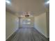 Bright Living room featuring gray wood-look flooring, a ceiling fan, and natural light at 741 Ellen St, Daytona Beach, FL 32114
