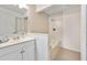 Clean bathroom featuring a single sink vanity, tiled bathtub, and shower at 915 Stonybrook Cir, Port Orange, FL 32127