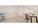 Bedroom with desk, closet with louvered doors, and carpet flooring at 915 Stonybrook Cir, Port Orange, FL 32127