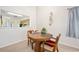 Cozy dining area with a pass-through to the kitchen at 915 Stonybrook Cir, Port Orange, FL 32127