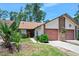 Charming home featuring a two-car garage and well-manicured front yard at 915 Stonybrook Cir, Port Orange, FL 32127