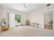 Bright living room with a sliding glass door to the outside, carpeted floors, and neutral walls at 915 Stonybrook Cir, Port Orange, FL 32127