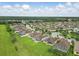 The community features lush lawns, mature trees, and well-maintained homes at 3345 Tesoro Cir, New Smyrna Beach, FL 32168