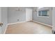 Neutral bedroom featuring wood-look tile flooring and a white closet door at 3345 Tesoro Cir, New Smyrna Beach, FL 32168