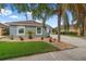 Attractive home with charming flowerbeds and a well-manicured lawn creates appealing curb appeal at 3345 Tesoro Cir, New Smyrna Beach, FL 32168