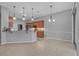 Open kitchen with stainless steel appliances, tile flooring, and ample counter space at 3345 Tesoro Cir, New Smyrna Beach, FL 32168