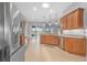 Modern kitchen featuring stainless appliances, granite countertops, and tile flooring at 3345 Tesoro Cir, New Smyrna Beach, FL 32168