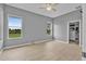 Spacious main bedroom with tile flooring, walk-in closet, and bright windows at 3345 Tesoro Cir, New Smyrna Beach, FL 32168